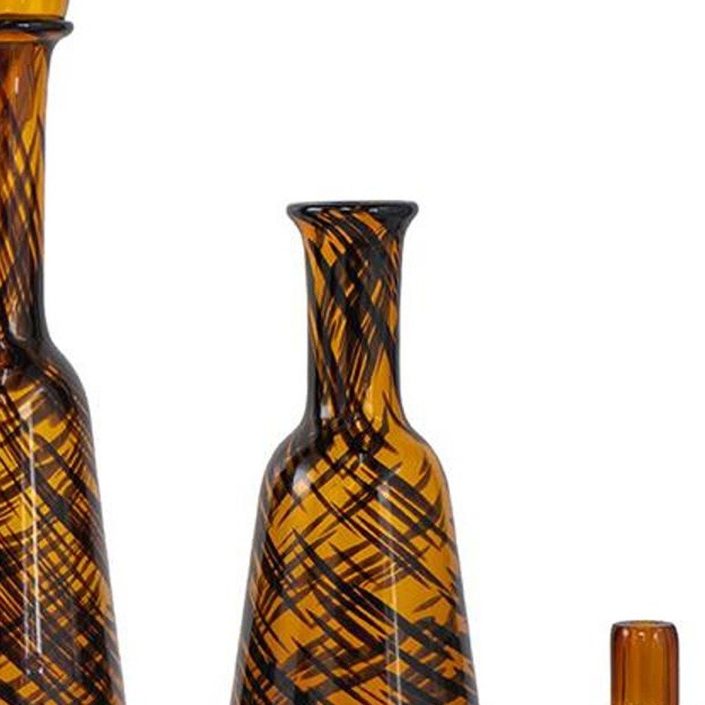 Set of Three Amber Abstract Swirl Glass Decorative Bottles With Stoppers