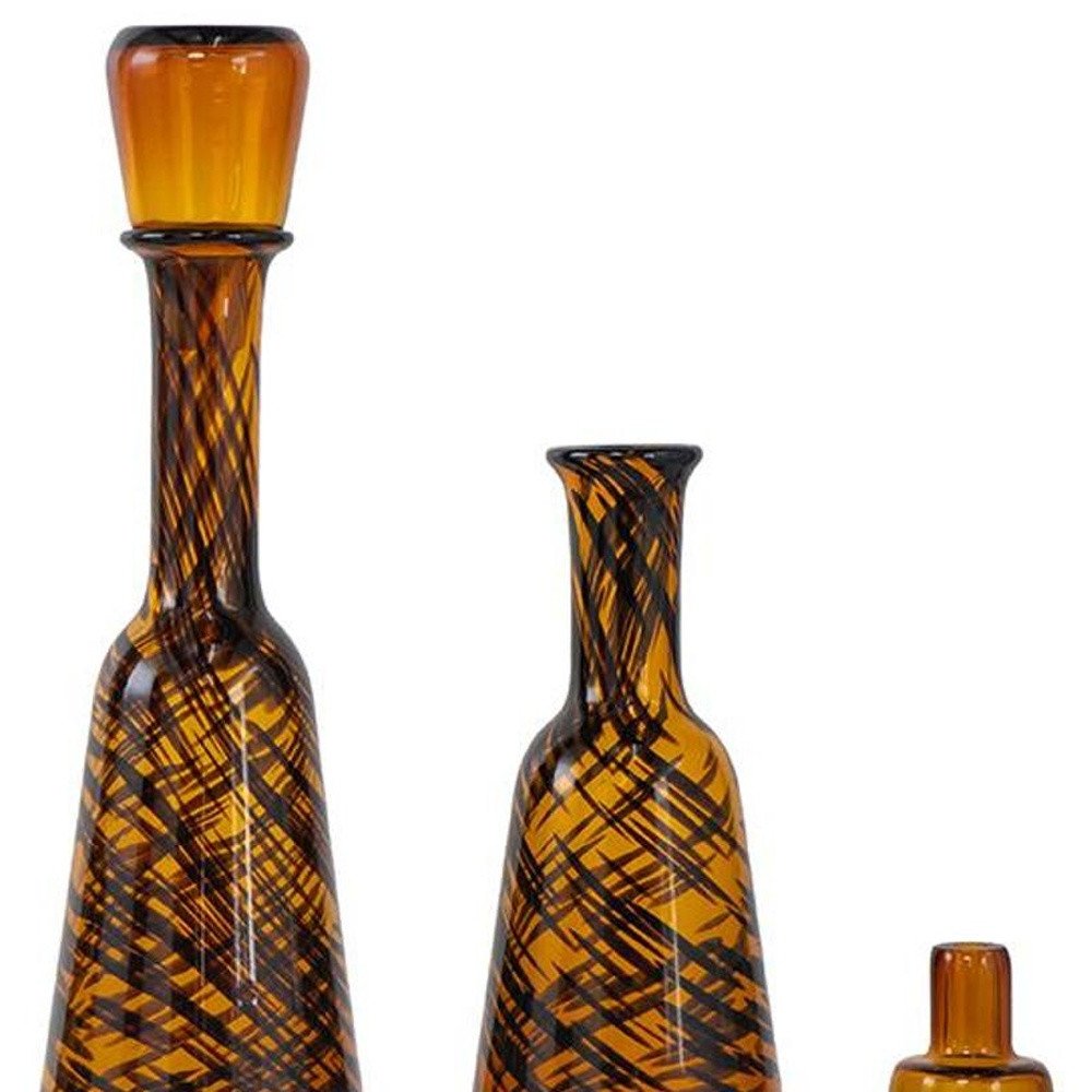 Set of Three Amber Abstract Swirl Glass Decorative Bottles With Stoppers